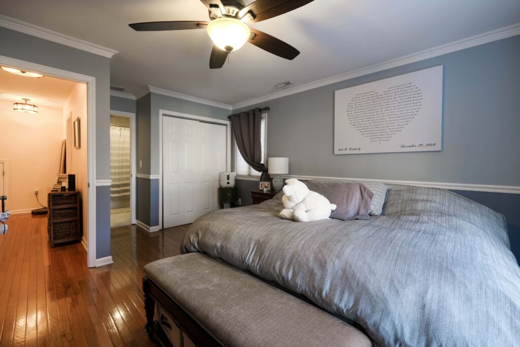 Master Bedroom, with hardwood floors and ceiling fan.